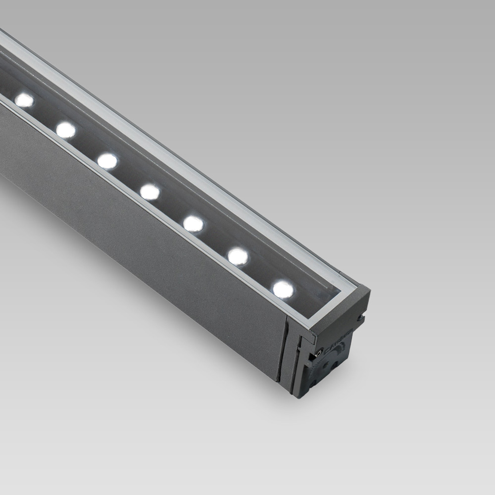 Facade fittings Wall-mounted luminaire for facade lighting with linear design and scenographic light effects